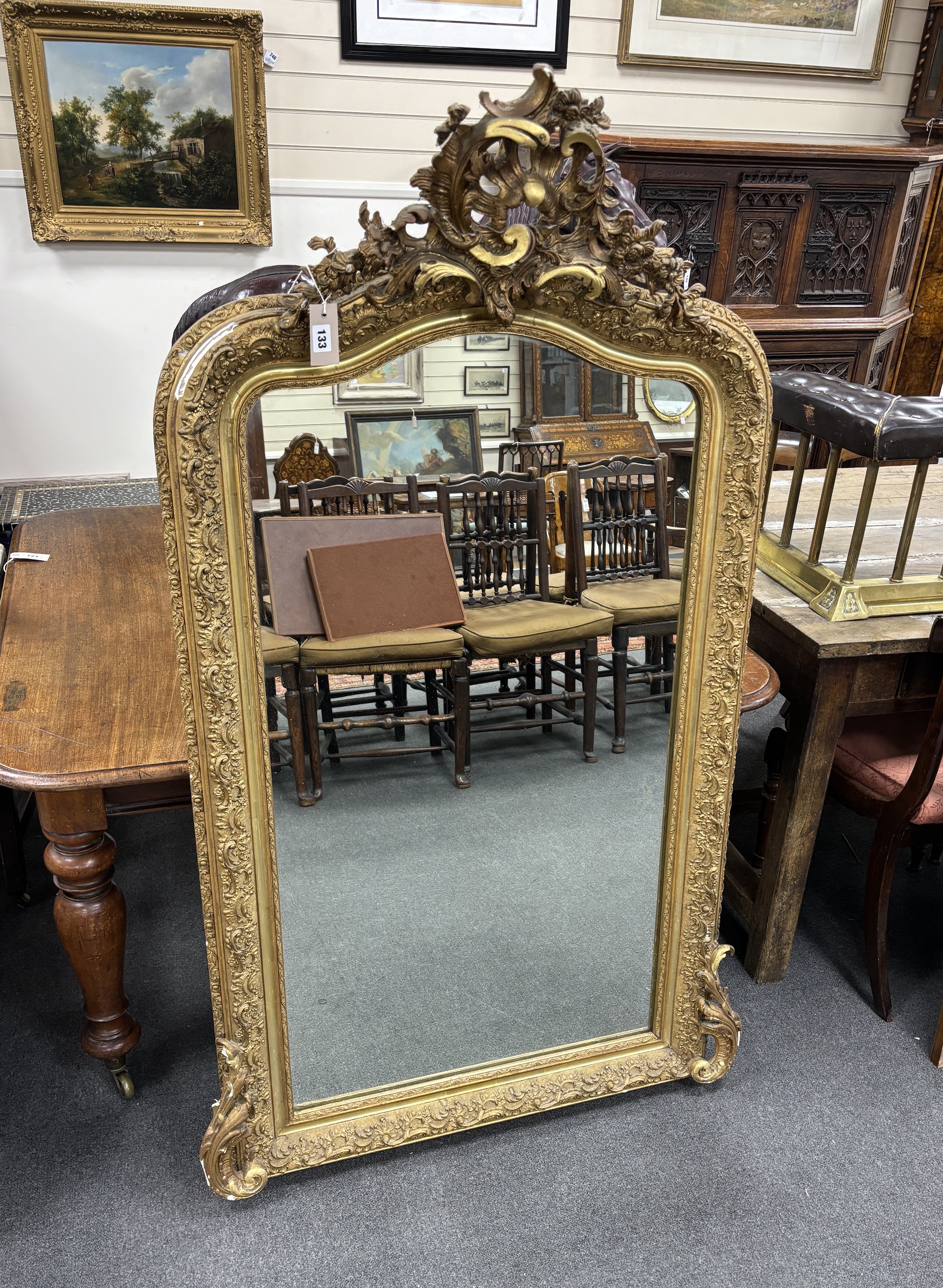 A 19th century French giltwood and composition overmantel mirror with pierced scroll pediment, width 86cm, height 158cm